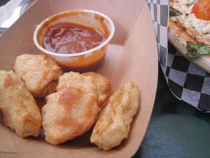 Vegan chickun nuggets (Croquettes de poulette) with tomato sauce. The nuggets are great eaten right away, but I would skip the sauce. at Resto Vego in Montreal