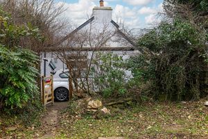 View from the garden to the parking space and back of cottage - taken during winter.  at Gorllan in Eglwyswrw