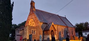 The church in front of the cottage at night at Gorllan in Eglwyswrw