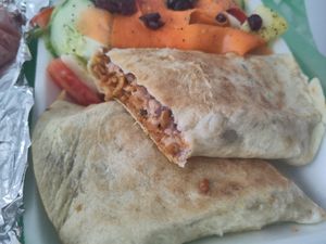 Tasty plant-based meat burrito and salad at Wake Up Vallarta in Puerto Vallarta