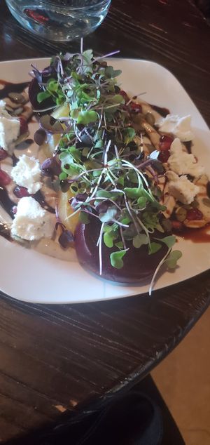 Roasted Beets: toasted pumpkin seeds, pomegranate molasses, pomegranate seeds, micro greens, and lemon tahini sauce w/ vegan garlic & herb cheese at World Cafe Live in Philadelphia