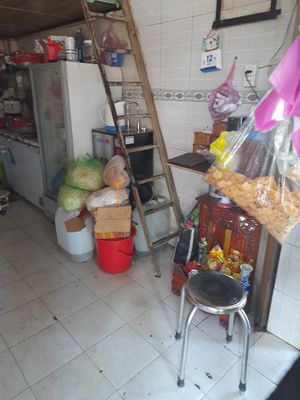 Kitchen area downstairs in the family home at Quán chay Thiện Quang in Ho Chi Minh City