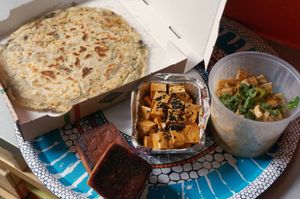Delivery: Leek/mushroom Feuilleté + Sweetsour tofu + Dandan noodles + Volcano cake at Toutofu in Paris
