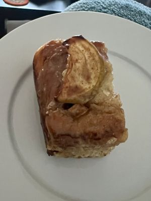 Half of an apple flavoured bun   at Roots Cafe Inv in Inverness