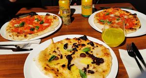 Pizzas and mango soft drinks at FLIP - Vegan Pizza in Tampere