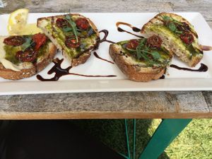 Vegan caprese toast with cashew cheese. at Healthy Being Juicery in Jackson
