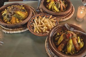 Veg tagine, couscous and fries at Bakchich Cafe in Marrakech