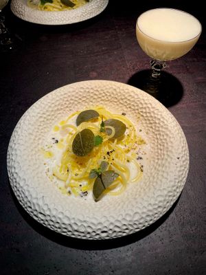 potato pasta in creamy almond-lemon sauce with caper leafs and fermented black pepper  at Pramerl & the Wolf in Vienna