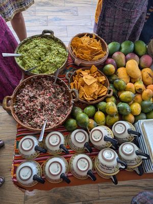Appetizers: different mango varieties, exotic fruit, guacamole, radish salad at Anita's Mayan Kitchen Cooking Class in San Pedro La Laguna