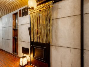 This is the entrance to Odoru. Look for the lanterns above your head and the sign at your feet. It's one floor up from the ground, on the left side of the corridor. at Japanese Fermented Degustation Bar ODORU in Osaka