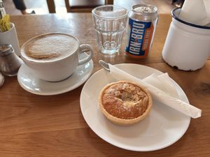 Oat latte and almond Bakewell tart    at The Heron Farm Shop & Kitchen in Strathaven