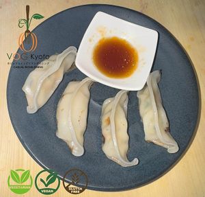 Vegan & Gluten Free! Delicate, pan-fried dumplings filled with a flavorful mix of Kyo Yasai (Kyoto Vegetables) and seasonings, served with a tasty dipping sauce. at VOG Kyoto in Kyoto