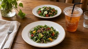 Kale, quinoa, cherry tomatoes, avocado, mushrooms — simple ingredients, honestly prepared. Two of our signature salads, paired with iced tea. at Touch Cafe in Tomigusuku