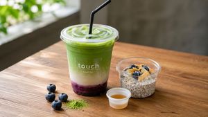 Blueberry matcha latte and chia seed pudding topped with blueberries and coconut. Naturally sweetened, made fresh. at Touch Cafe in Tomigusuku