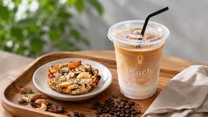 Our Superfood Cookie, packed with nuts, seeds, and dried fruit, served alongside our iced oat latte. Real ingredients, no shortcuts. at Touch Cafe in Tomigusuku