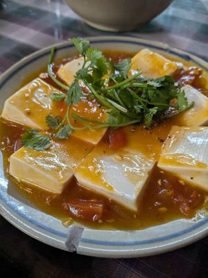Silken tofu in tomato sauce at Vườn chay Quin's Garden in Dong Ha