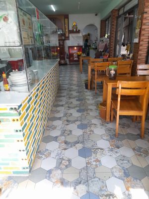 She sublets from the main restaurant. Access to their facilities including this dining area at Hu Tiệu Chay in Ho Chi Minh City