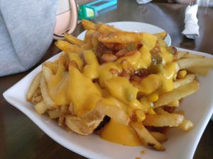 chilli cheese fries at Grasshopper - College St in Toronto