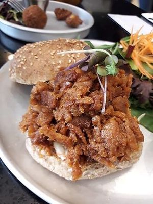 pulled pork burger with side salad  at Grasshopper - College St in Toronto