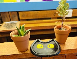 An adorable kitty coaster inside .  at Pawsitive Vibes in Kuching