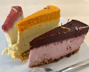 Vegan cheesecake: Blueberry & lavender, mango & sea buckthorn, and raspberry & pineapple   at Delicious Raw by Gabriela Oltean in Brasov