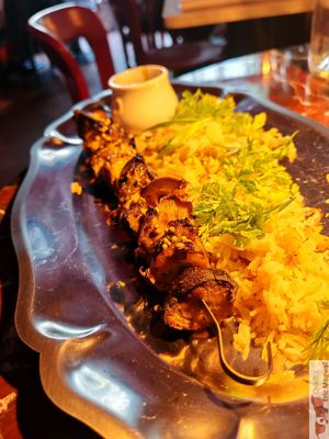 FIRE-GLAZED BROCHETTE WITH PILAF

Juicy skewer of sliced thistle-eared mushrooms, grey oyster mushrooms and shiitake mushrooms, intensely marinated and grilled, coriander seeds a at Daimant Saint-Honoré in Paris