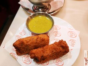 HOUSE SPECIALTY: “CROQUETTES COCHONNES”

HOMEMADE FILLING WITH MUSHROOMS AND SMOKED TOFU, DELICATE JELLY, CRISPY BATTER, AND RAVIGOTE SAUCE. at Daimant Saint-Honoré in Paris
