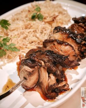 FLAME‑GLAZED SKEWER, SIGNATURE JUS

SKEWER OF KING OYSTER, OYSTER AND SHIITAKE MUSHROOMS, VEG JUS, TANGY YOGURT, LEMONGRASS RICE. at Daimant Saint-Honoré in Paris