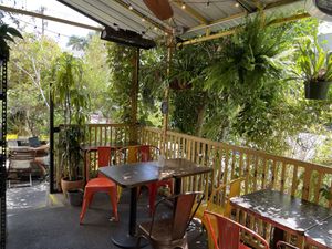 Part of the outdoor dining area. The plants are a nice hedge blocking the view of the parking lot right next to it    at Yuko Kitchen in Los Angeles