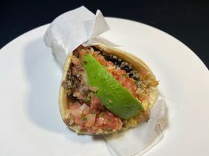 Vegan TACO: 2 corn tortillas with quinoa, black beans, salsa fresca & avocado slice. at Adelitas Taqueria in San Jose