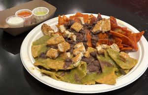 Chilaquiles (requested black beans instead of refried beans, Garden chicken, red and green sauce, no onions, no queso fresco, crema on the side )  at Tacotarian - Miracle Mile in Las Vegas