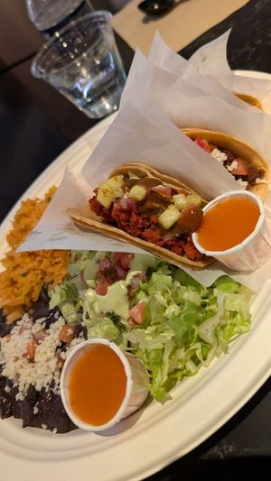Taco platter -- let's you sample 3 different tacos. The black beans and rice were excellent. at Tacotarian - Miracle Mile in Las Vegas