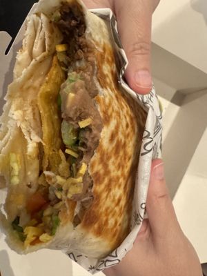 Crunchwrap in process with asada  at Tacotarian - Miracle Mile in Las Vegas