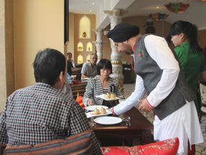 staff serving at redfort at Redfort Indian Restaurant in Xian