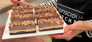 Decadent Desires: Our version of a Healthy Snickers Bar with pecan caramel. at Conscious Kitchen Atx in West Lake Hills