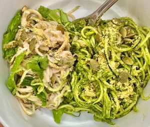 Alfredo and Pesto Zoodles: We make angel hair pasta from real zucchinis then marinate them in either pesto or Alfredo, made from walnuts, shiitake mushrooms & herbs from our garden at Conscious Kitchen Atx in West Lake Hills