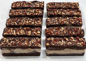 Decadent Desires: Our version of a Healthy Snickers Bar! All desserts are made with dates and maple syrup.  at Conscious Kitchen Atx in West Lake Hills