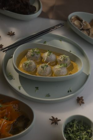 Crystal Dimsums Dipped in Yellow Curry at Arth - Food For Your Soul in Gurgaon