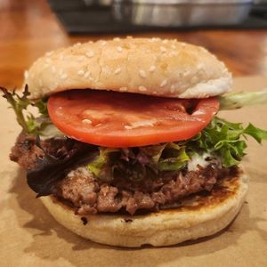 Our black bean burger served with a fresh spring mix, tomato, and vegan mayo. at Farm Burger in Memphis