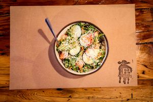 Our Garden Salad made with fresh spring mix, sliced radish, shredded carrots, tomato, cucumber and lemon vinaigrette. Can be served without cheese. at Farm Burger in Memphis