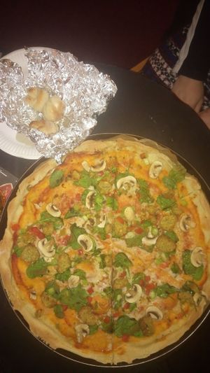 Vegandary pizza with extra falafel, and garlic knots. at Maguire's Pizza Bar in Liverpool