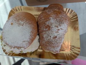 Creamy pistachio pastry and marmalade croissant at Panificio Brizzolari in Peschiera Del Garda
