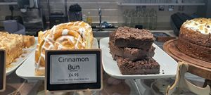 Vegan cake options: cinnamon bun & chocolate and avocado brownie at PERK in Largs