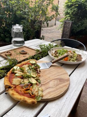 The pizza is around 16”. Enough for two    at Hungry Buddha - Maybe closed in Shaxi