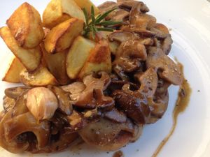 Homemade seitan with local mushrooms and baked rosemary potatoes at Hungry Buddha - Maybe closed in Shaxi