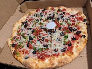 Vegan with green peppers, black olives and vegan bacon at Galactic Pizza in Minneapolis