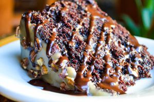 Vegan Turtle Cake - Layers of moist chocolate cake with toasted pecans & house-made vegan caramel sauce at French Meadow Bakery & Cafe in Minneapolis
