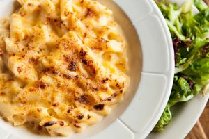 Signature Vegan Mac & Cheese (gluten-free) - organic gluten-free penne, cashew "cheddar" sauce, served with organic spring greens & white balsamic vinaigrette at French Meadow Bakery & Cafe in Minneapolis