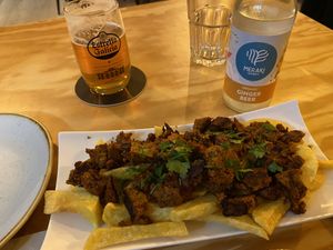 Zorza con patacas and an artisan beer and a ginger beer. at Entre Pedras in Santiago De Compostela
