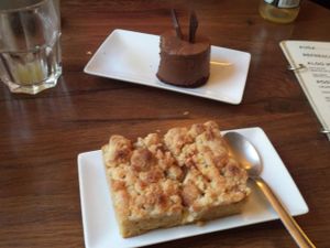 Chocolate dessert on top and apple crumble on the bottom at Entre Pedras in Santiago De Compostela